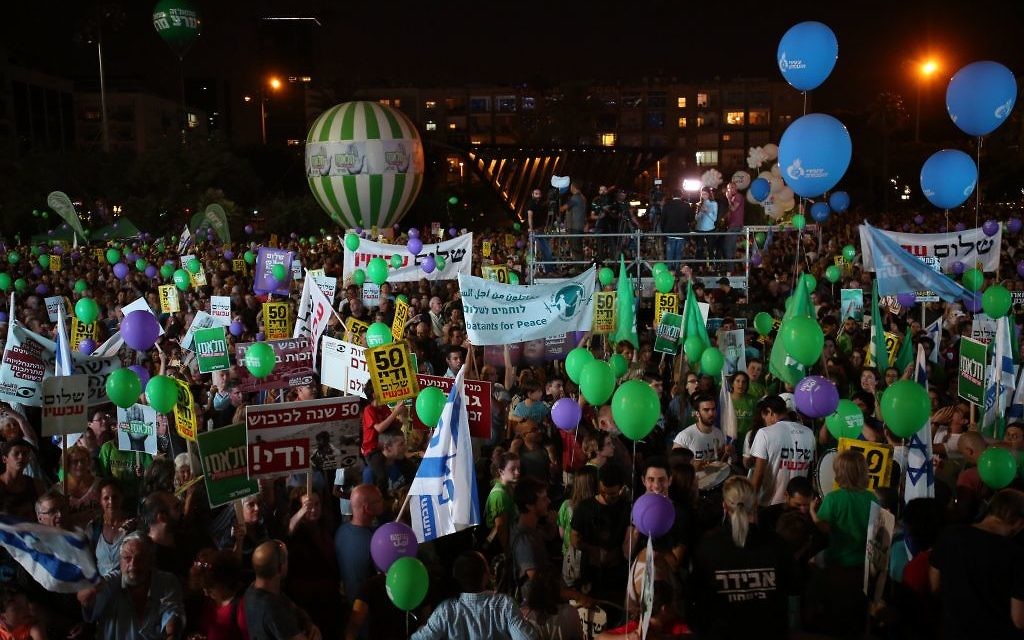 Israelis take part in a rally in support of establishing a Palestinian state alongside Israel to end the conflict, in Tel Aviv, Israel, Saturday, May 27, 2017. Yellow signs read: "50 years is enough, peace now. 

Photo by: Daniel Bar-On-JINIPIX