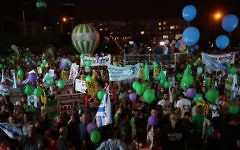 Israelis take part in a rally in support of establishing a Palestinian state alongside Israel to end the conflict, in Tel Aviv, Israel, Saturday, May 27, 2017. Yellow signs read: "50 years is enough, peace now. 

Photo by: Daniel Bar-On-JINIPIX