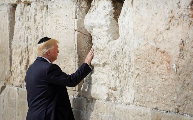U.S. President Donald Trump places a note in the stones of the Western Wall, Judaism's holiest prayer site, in Jerusalem's Old City 


Photo by: Nati Shochat-JINIPIX