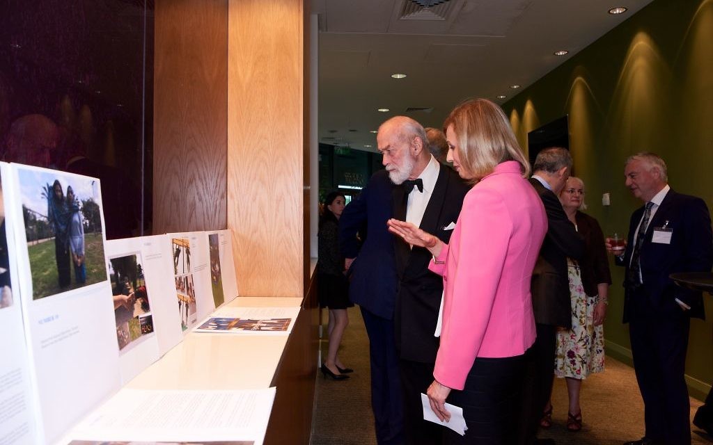 Prince Michael of Kent looking at the art exhibition with Elise Moore-Searson