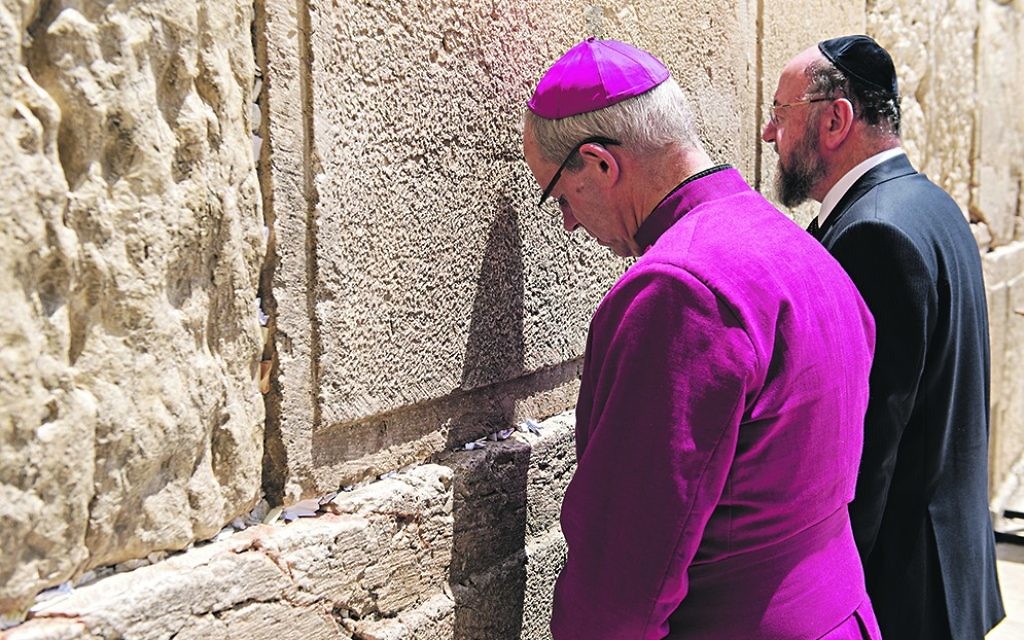 Chief Rabbi Ephraim Mirvis and Archbishop of Canterbury Justin Welby at the Western Wall in Jerusalem, praying together.