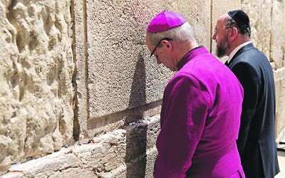 Chief Rabbi Ephraim Mirvis and Archbishop of Canterbury Justin Welby at the Western Wall in Jerusalem, praying together.