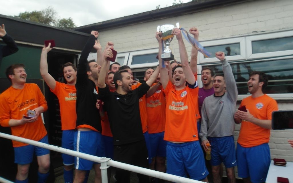 Raiders C's men's team celebrate winning the MMFL/MGBSFL Invitational Trophy.
