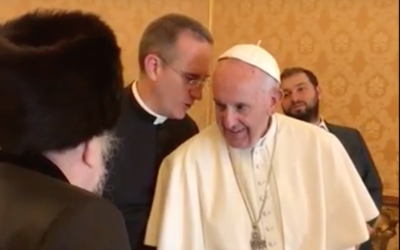 Pope speaking with a senior rabbi of the delegation