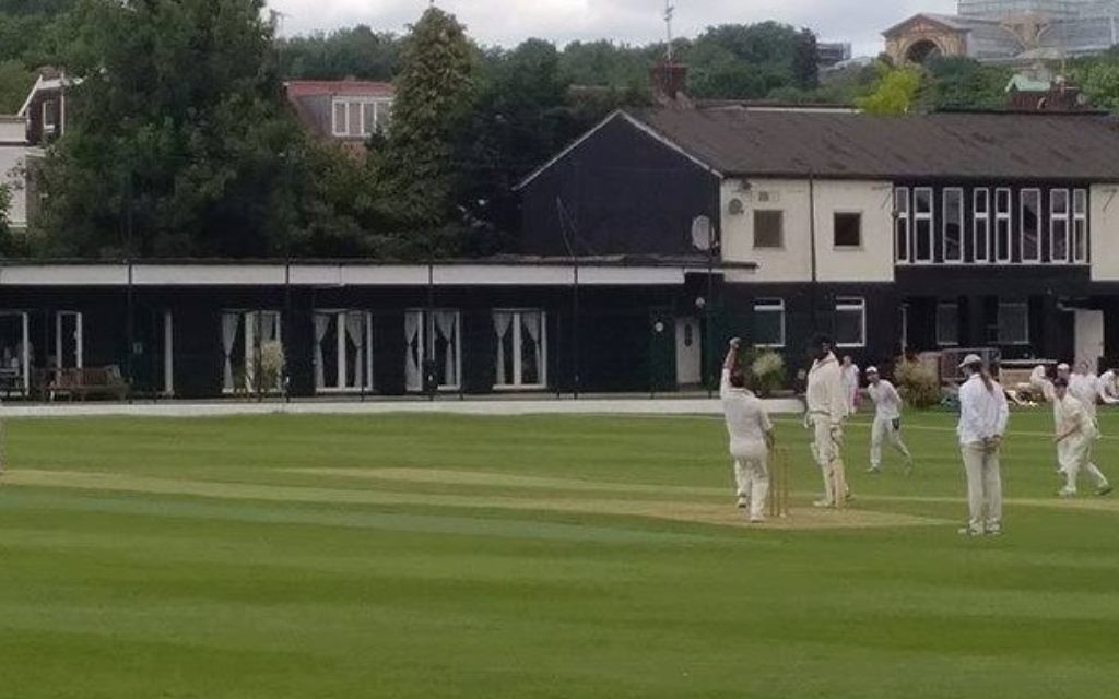 David Kay bowling one of his three overs, which saw him take a wicket