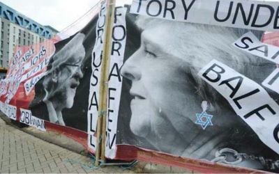 A photo of the banner, featuring Theresa May with a Magen David earring, and the word 'Balfour'

Photo: Jennie Banks/Bristol Post