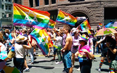 Jewish LGBT flags held during the San Francisco Pride Parade, June 30, 2014. (Wikimedia Commons)