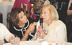 Natasha Kaplinsky listens to survivor Gina Turgel.