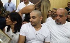 IDF Sgt. Elor Azaria, the Israeli soldier, who shot dead a disarmed and injured Palestinian attacker in the West Bank city of Hebron, sits at the courtroom as he arrives to hear the decision on his appeal at the Kirya military base in Tel Aviv 

Photo by Avshalom Sasoni/POOL via JINIPIX