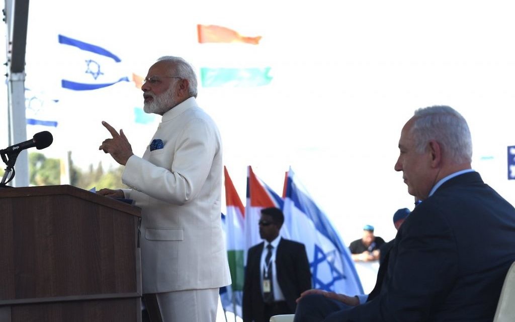 Narendra Modi speaking as Israeli leader Benjamin Netanyahu looks on