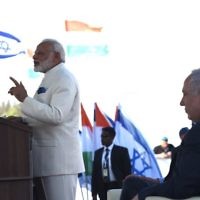 Narendra Modi speaking as Israeli leader Benjamin Netanyahu looks on