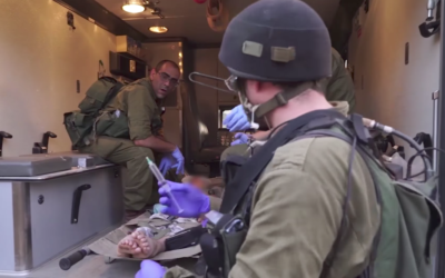 Israeli soldiers delivering aid and assistance to Syrians