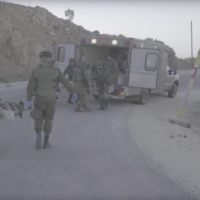 Israeli soldiers delivering aid and assistance to Syrians