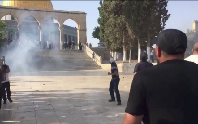 Police clash with Palestinians on Temple Mount. 

Source: Screenshot from Twitter