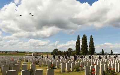 Jets perform a fly-past over Tyne Cot Commonwealth cemetery in Belgium, honouring thousands who died.