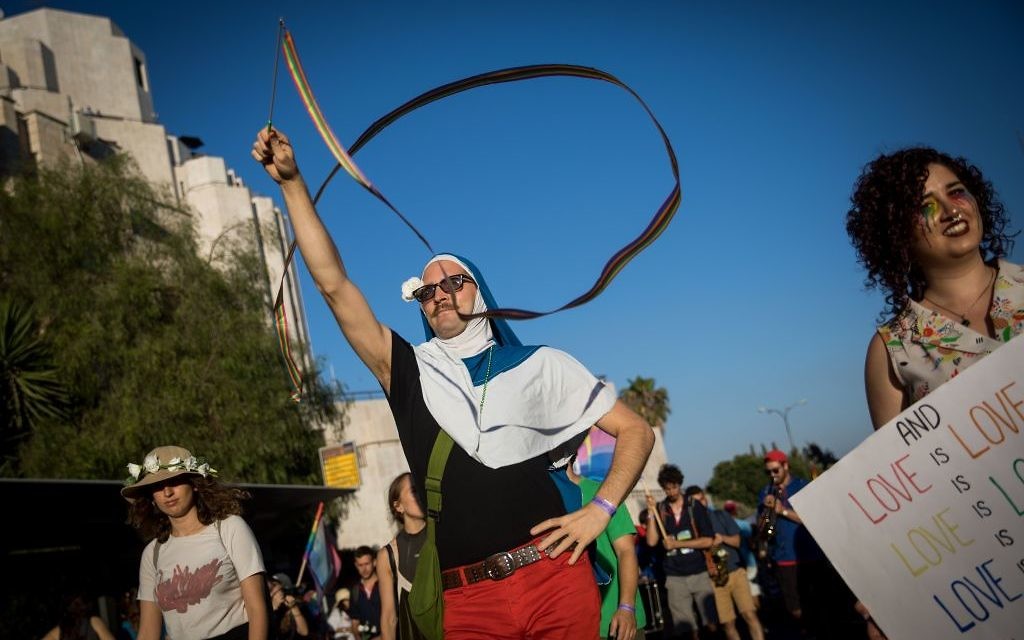 People participate in the annual Gay Pride parade in central Jerusalem, under heavy security on August 3, 2017. Photo by: JINIPIX