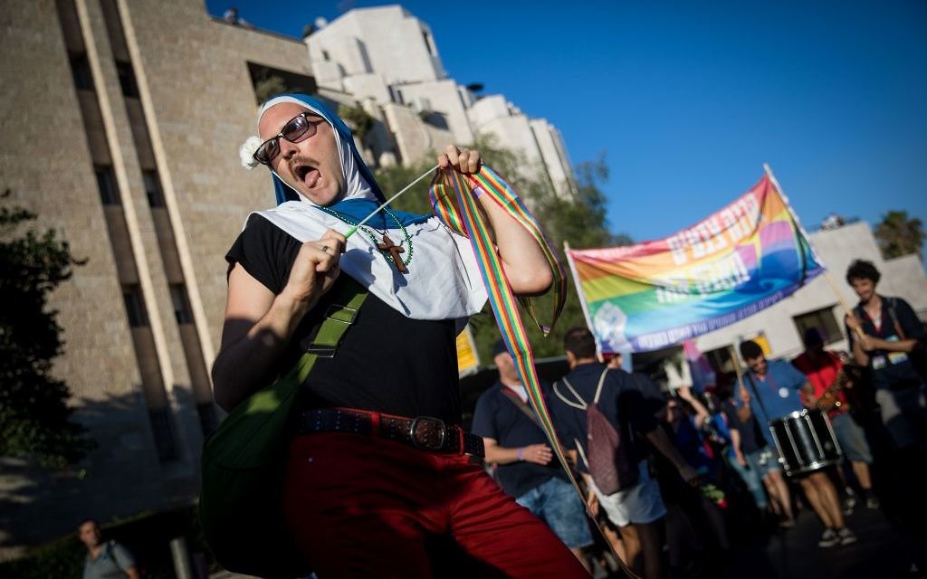 People participate in the annual Gay Pride parade in central Jerusalem, under heavy security on August 3, 2017. Photo by: JINIPIX