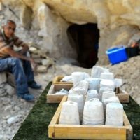 Employees of the Israel Antiquities Authorities (IAA) work during archaeological excavations in a newly discovered small cave at the Arab town of Reina in Galilee. The excavations at the ancient site uncovered a 2,000-year-old workshop for the production of stone vessels, including remains of chalkstone mugs and bowls. 

Photo by: Gil Eliyahu - JINIPIX