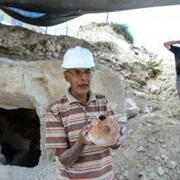 Employees of the Israel Antiquities Authorities (IAA) work during archaeological excavations in a newly discovered small cave at the Arab town of Reina in Galilee. 
Photo by: Gil Eliyahu - JINIPIX