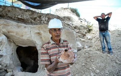 Employees of the Israel Antiquities Authorities (IAA) work during archaeological excavations in a newly discovered small cave at the Arab town of Reina in Galilee. 
Photo by: Gil Eliyahu - JINIPIX