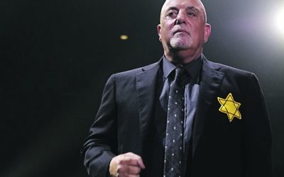 Billy Joel wearing a yellow Star of David