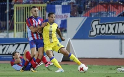 Eyal Golasa (yellow) in action for Maccabi Tel Aviv during their match against Panionios on Thursday. Picture: MTA