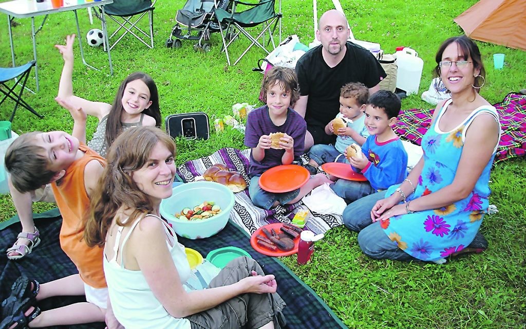 The late Jonny Zucker, with his wife Fiona and their three sons.