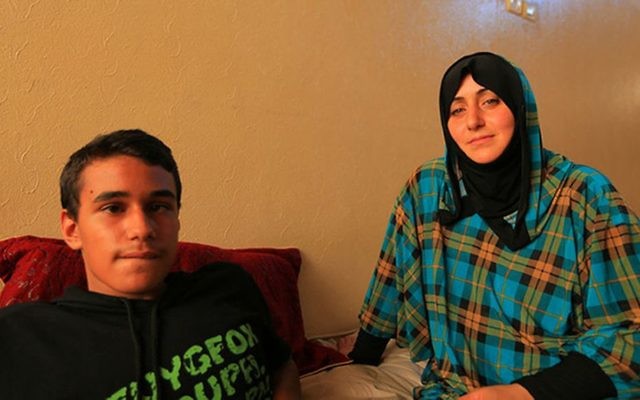 Palestinian mother Yara with her son Ali, 15, who suffers from cerebral palsy, as one million children in Gaza are enduring "unlivable" conditions amid widespread power cuts, according to a leading NGO Save The Children. Photo credit: Save the Children/PA Wire
