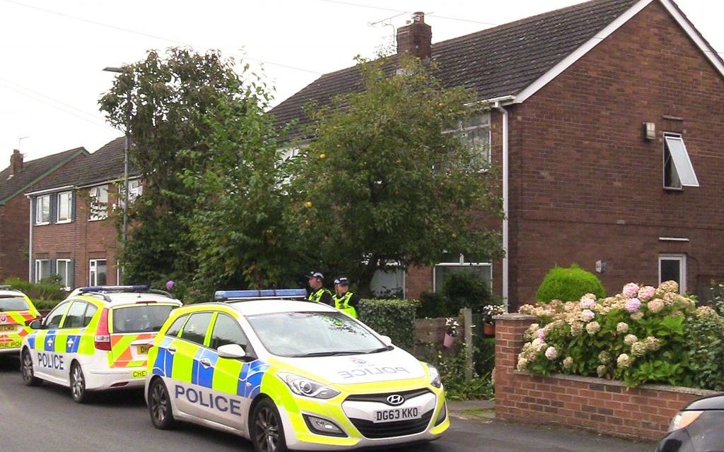Police at the scene in Greymist Avenue,, Cheshire, following a police counter-terrorism raid