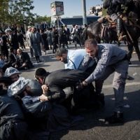 Ultra-Orthodox Jewish clash with Israeli police during a protest against the arrest of rabbi Shmuel Ya'akov Kahn grandson who failed to comply with a recruitment order, near the army recruiting office in Jerusalem

Photo by: JINIPIX
