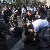 Ultra-Orthodox Jewish clash with Israeli police during a protest against the arrest of rabbi Shmuel Ya'akov Kahn grandson who failed to comply with a recruitment order, near the army recruiting office in Jerusalem

Photo by: JINIPIX