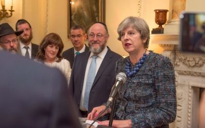 Theresa May speaking at the Rosh Hashanah reception in Downing Street, in front of Chief Rabbi Ephraim Mirvis, Israeli envoy to the UK Mark Regev, and other community members
