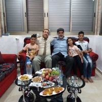 Likud Party MK Yehuda Glick with Muhammad Sabir Jabir and his family in his Hebron  home