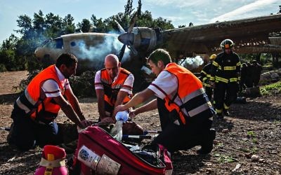 Israeli rescuers train for an emergency using realistic looking fake limbs,