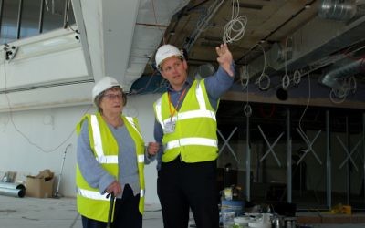 Survivor Iby Knill shares a joke with Greg Brinkworth, Project Manager for HHLC contractors Harry Fairclough Construction