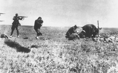 Einsatzgruppen members killing Jews in Ivanhorod, Ukraine, 1942. A woman is attempting to protect a child with her own body just before they are fired upon with rifles at close range.