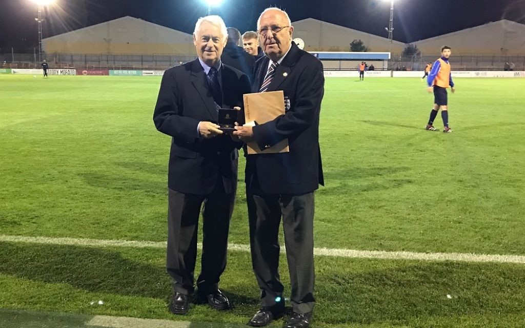 Lustigman (left) being presented his award