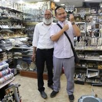 Let's Talk Business participants engaging with Jewish traditions in a shop