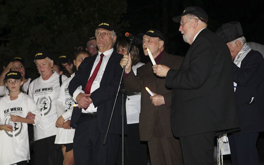 Young and old remember Elie Wiesel at the Holocaust memorial in Sighet