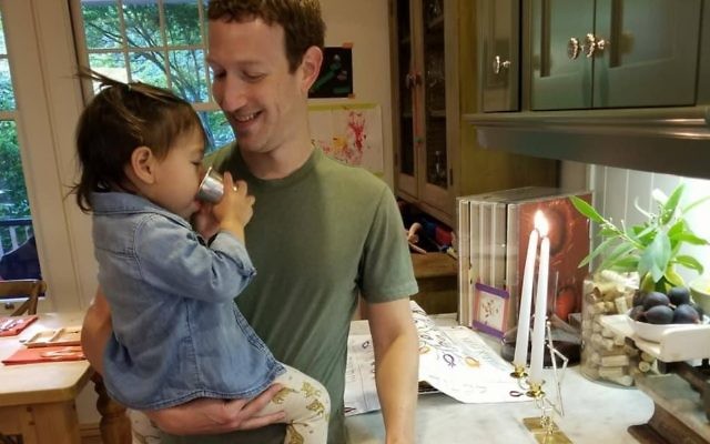 Zuckerberg and daughter Max drinking from the family heirloom