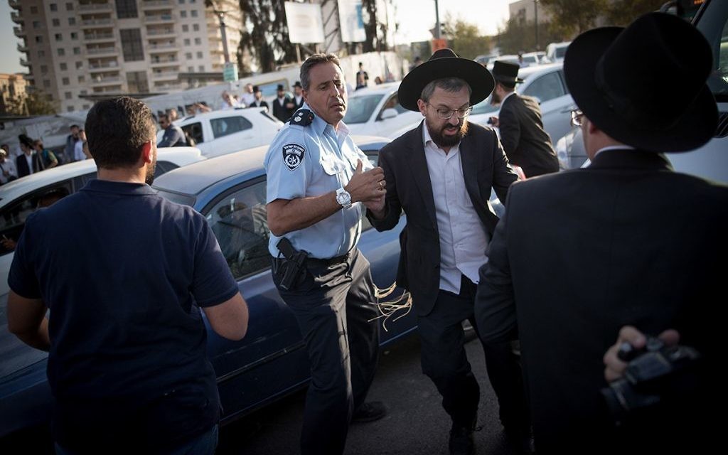 Ultra Orthodox Jewish men are being arrested by Israeli police as they block a road during a protest in Jerusalem, Israel, 19 October 2017.  

 Photo by: JINIPIX