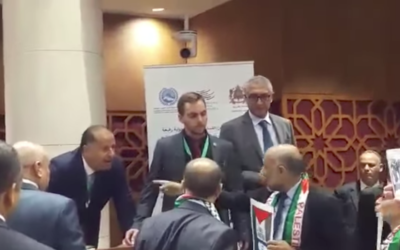 Moroccan politicians with Palestinian scarves verbally attack Amir Peretz, an Israeli former Defence minister, during a visit in Rabat. An Israeli Druze lawmaker came to Peretz’s Defence in Arabic.