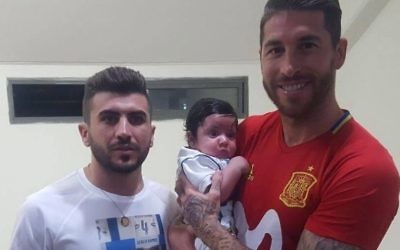 Sergio Ramos, pictured holding Ramos and with the brother of murdered police officer Haiel Sitawe