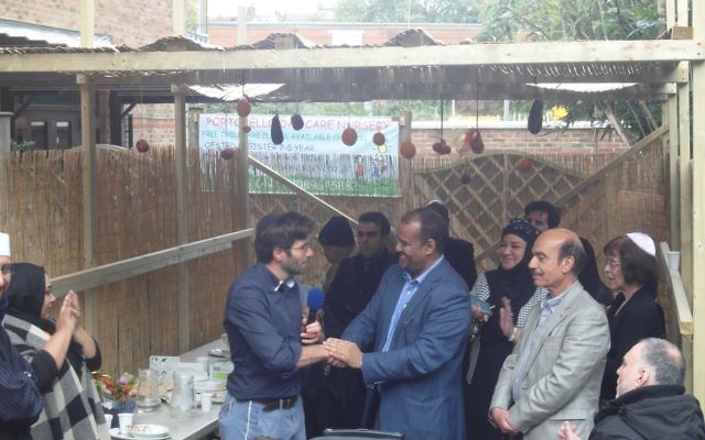 Rabbi Levy and Abdurahman Sayed addressed attendees at the Al Manaar Mosque's succah