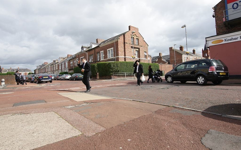 Orthodox Jewish teens crossing the road in Gateshead