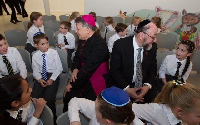 Chief Rabbi Ephraim Mirvis and Bishop John Keenan talk to students at the new school