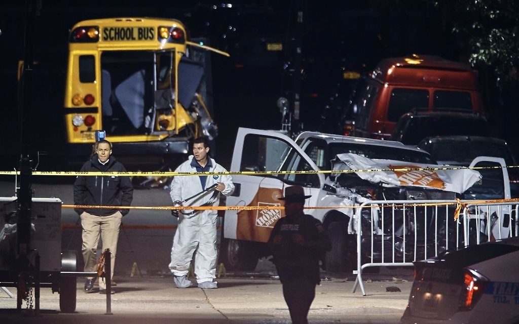 Police work near a damaged Home Depot truck after a motorist drove onto a bike path near the World Trade Centre memorial, striking and killing several people

 (AP Photo/Andres Kudacki)