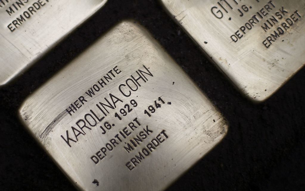 "Stolpersteine" (stumbling blocks) laid in Frankfurt, German(AP Photo/Michael Probst) "Stolpersteine" (stumbling blocks) laid in Frankfurt, German(AP Photo/Michael Probst)