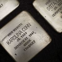 "Stolpersteine" (stumbling blocks) have been laid for Karolina Cohn and her family at a place where they once lived in Frankfurt, German(AP Photo/Michael Probst)