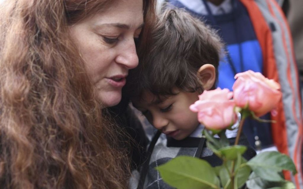 Mandy Eisemann from Dickerson, Maryland. with her son Levi (4), relatives of the Cohn family, places flowers at four "Stolpersteine" (stumbling blocks) for Karolina Cohn and her family in Frankfurt, Germany
(Arne Dedert/dpa via AP) Mandy Eisemann from Dickerson, Maryland. with her son Levi (4), relatives of the Cohn family, places flowers at four "Stolpersteine" (stumbling blocks) for Karolina Cohn and her family in Frankfurt, Germany
(Arne Dedert/dpa via AP)